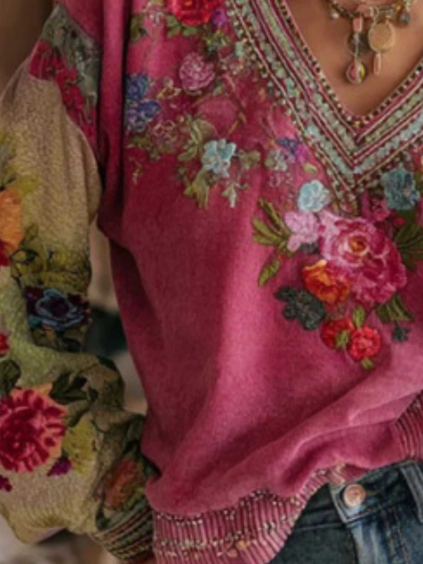 NEWYORKLISTED STYLE COLLECTION: Close-up of a pink embroidered garment with floral patterns