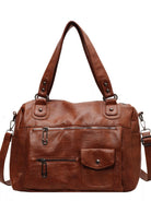 NEWYORKLISTED STYLE COLLECTION: Brown leather handbag with multiple pockets and straps on a white background