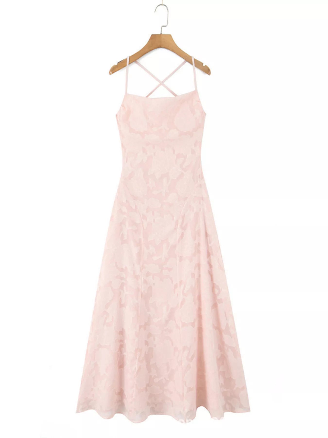 NEWYORKLISTED STYLE COLLECTION: Pink dress with criss-cross straps on a hanger against a white background