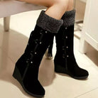NEWYORKLISTED SHOE COLLECTION: Black knee-high boots with textured cuffs on a light background
