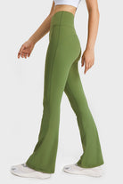 NEWYORKLISTED ACTIVEWEAR COLLECTION: Green flared pants worn by a person on a white background