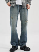 NEWYORKLISTED ATLAS MEN's COLLECTION: Person wearing ripped blue jeans and a checkered shirt on a white background