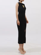 NEWYORKLISTED RUNWAY STYLE: Black sleeveless dress with a gold design on a white background