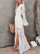 NEWYORKLISTED STYLE COLLECTION: Woman wearing a white lace dress with a gray background