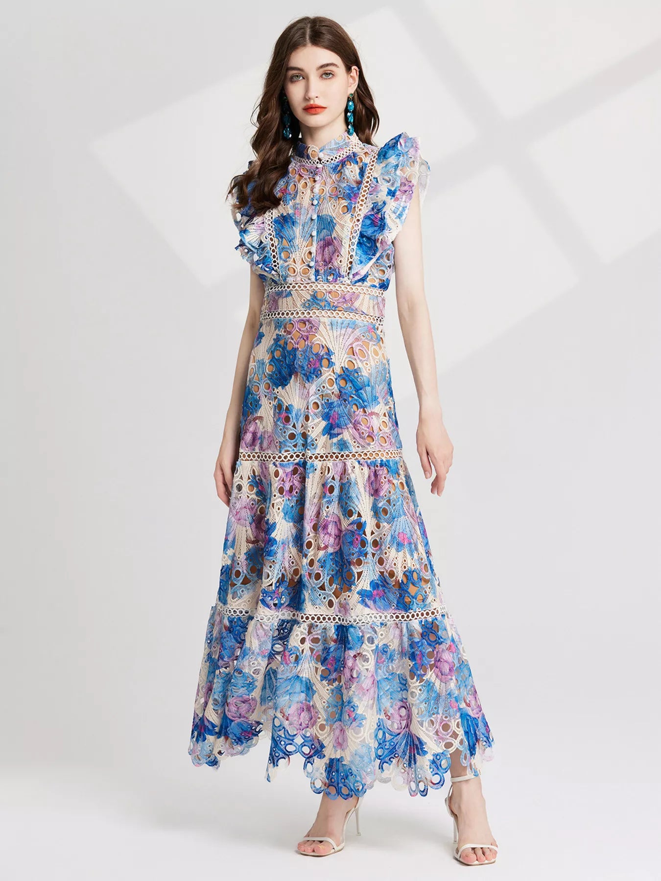 NEWYORKLISTED STYLE COLLECTION: Woman wearing a floral dress on a white background