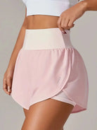 NEWYORKLISTED Activewear: Person wearing a pink athletic skirt with a white top on a plain background