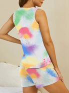 NEWYORKLISTED Intimate Apparel: Woman wearing a colorful tie-dye dress against a neutral background