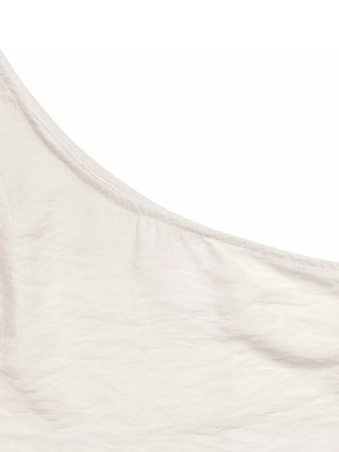 NEWYORKLISTED STYLE COLLECTION: Close-up of a beige fabric texture on a white background