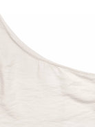 NEWYORKLISTED STYLE COLLECTION: Close-up of a beige fabric texture on a white background