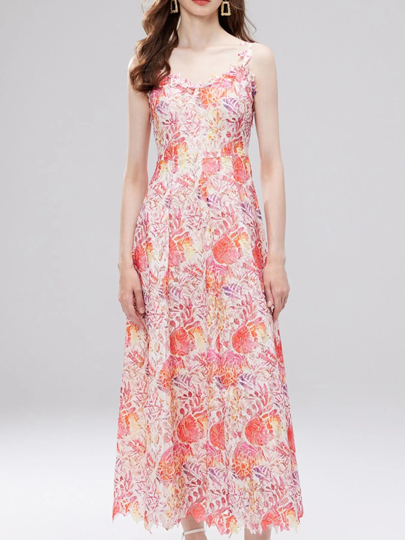 NEWYORKLISTED STYLE COLLECTION: Woman wearing a floral dress on a plain background