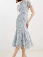 NEWYORKLISTED STYLE COLLECTION: Light blue lace dress on a white background
