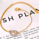 NEWYORKLISTED Valentine's Day Specials: Gold bracelet with a heart-shaped charm on a white background