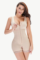 NEWYORKLISTED Intimate Apparel: Woman wearing a beige shapewear bodysuit on a white background