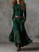 NEWYORKLISTED Style Collection: Woman wearing a long green dress with plaid pattern and brown belt against a gray background