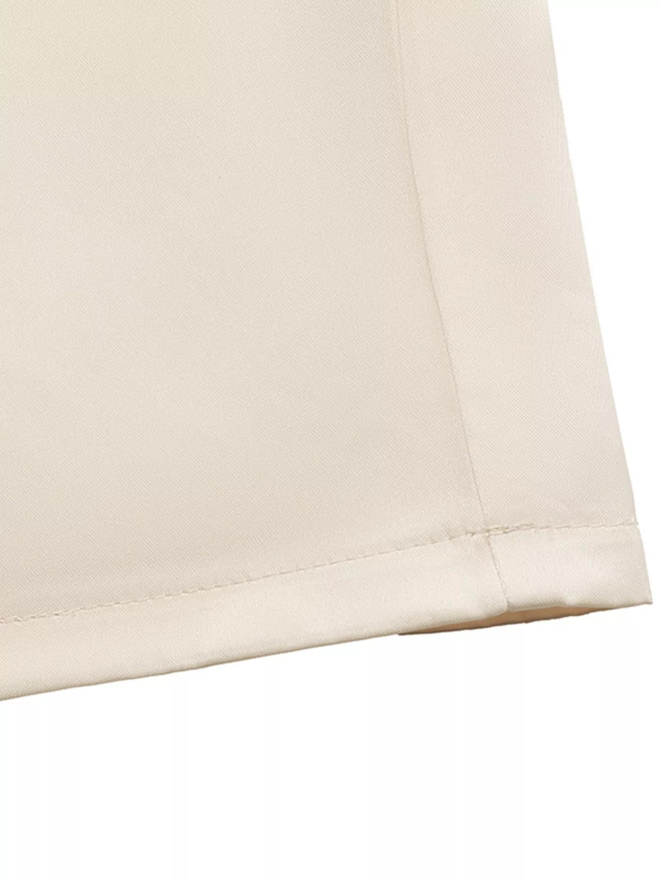 NEWYORKLISTED STYLE COLLECTION: Close-up of beige fabric with a subtle texture on a white background