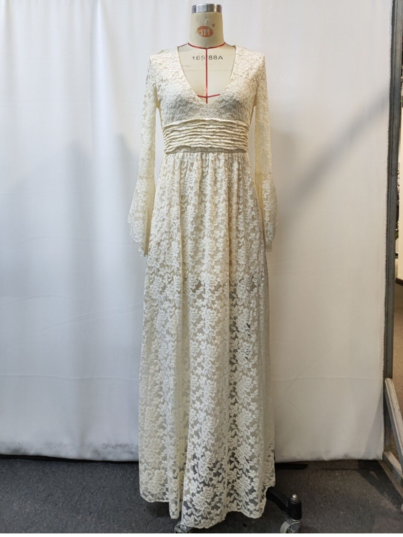 NEWYORKLISTED STYLE COLLECTION: Long floral dress on a mannequin against a white background