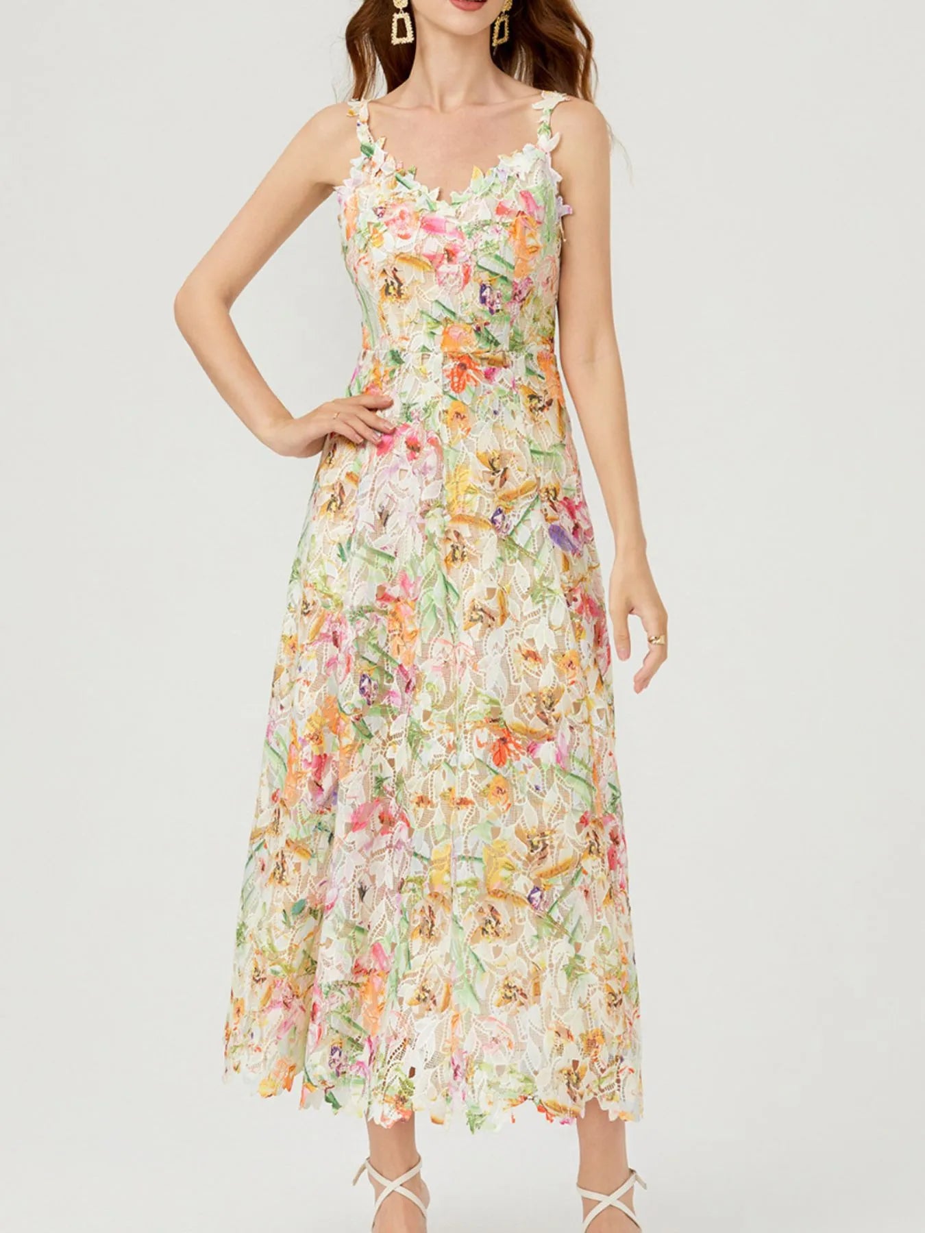 NEWYORKLISTED STYLE COLLECTION: Woman wearing a floral dress on a white background
