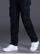 NEWYORKLISTED ATLAS MEN's COLLECTION: Black cargo pants worn by a person on a gray background