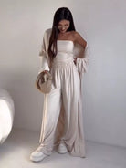 NEWYORKLISTED COMFORT COLLECTION: Woman wearing a white outfit with a plain background