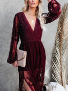 NEWYORKLISTED STYLE COLLECTION: Woman wearing a burgundy lace dress with long sleeves, holding a beige clutch against a neutral background.