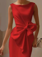 NEWYORKLISTED STYLE COLLECTION: Red dress with a large bow detail on a neutral background