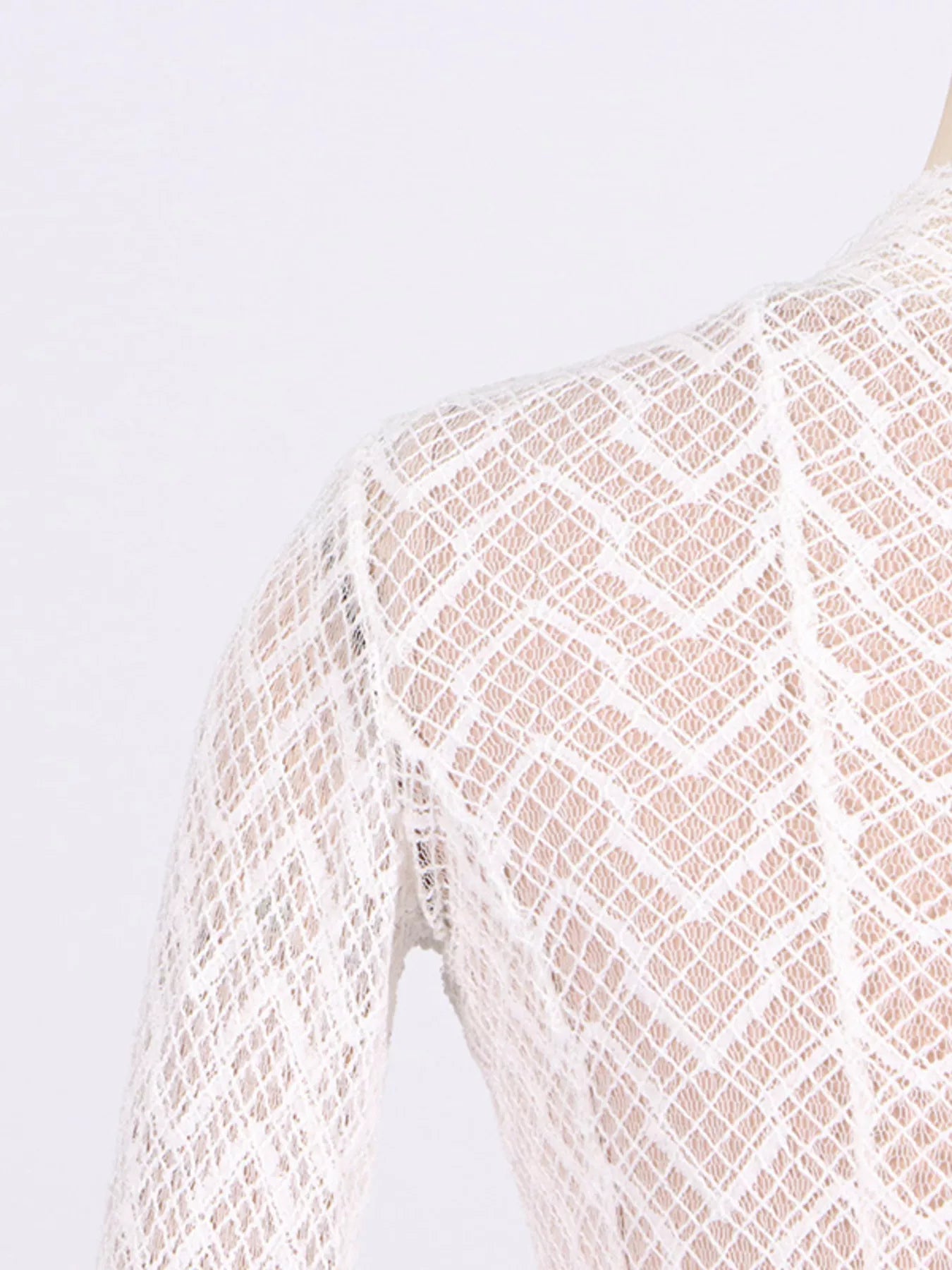 NEWYORKLISTED STYLE COLLECTION: Close-up of a textured fabric with a geometric pattern on a white background