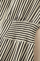 NEWYORKLISTED STYLE COLLECTION: Close-up of a black and white striped garment with a textured pattern.