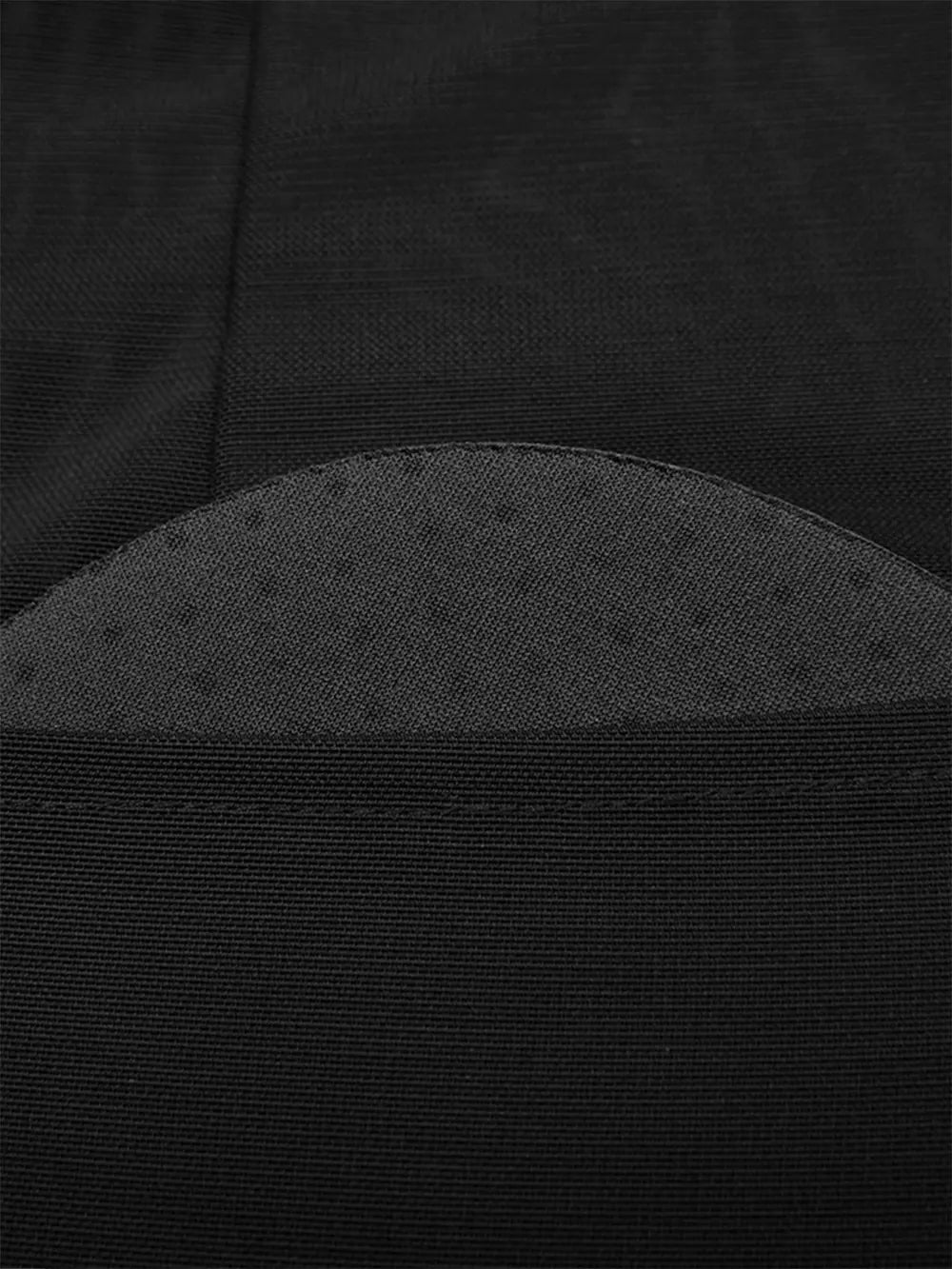 NEWYORKLISTED Intimate Apparel: Close-up of a black fabric texture with a subtle pattern
