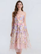 NEWYORKLISTED STYLE COLLECTION: Woman wearing a floral dress on a white background