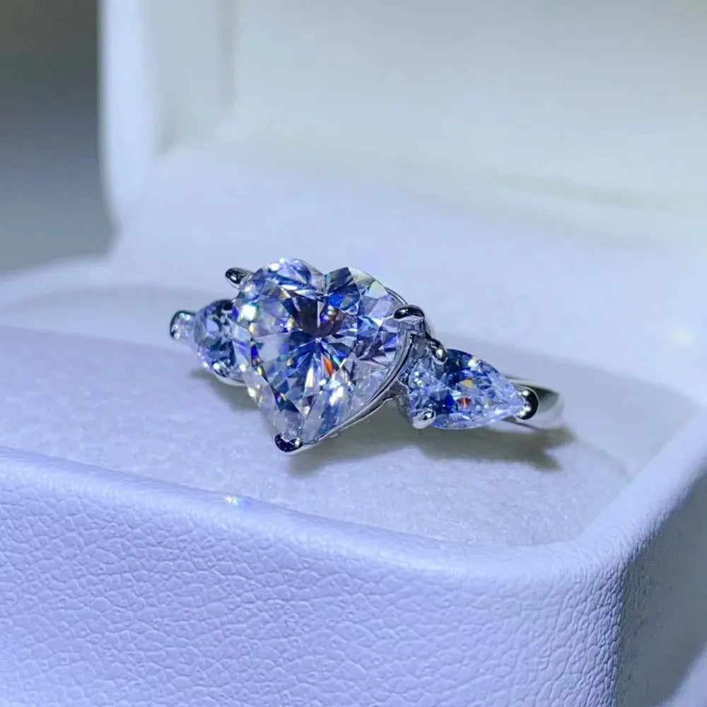 NYLD Glamour Collection By NEWYORKLISTED: Heart-shaped diamond ring on a white cushion
