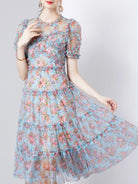 NEWYORKLISTED STYLE COLLECTION: Woman wearing a floral dress with a light gray background