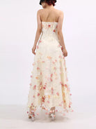 NEWYORKLISTED STYLE COLLECTION: Woman wearing a strapless floral gown on a white background