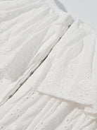 NEWYORKLISTED STYLE COLLECTION: Close-up of a textured white fabric with a subtle pattern