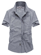 NEWYORKLISTED ATLAS MEN's COLLECTTION: Gray short-sleeve shirt with 'Sun Port' branding on a white background