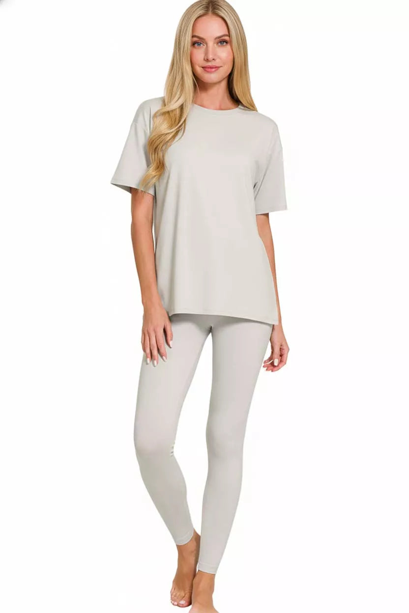 NEWYORKLISTED COMFORT COLLECTION: Model wearing a light gray t-shirt and leggings on a white background